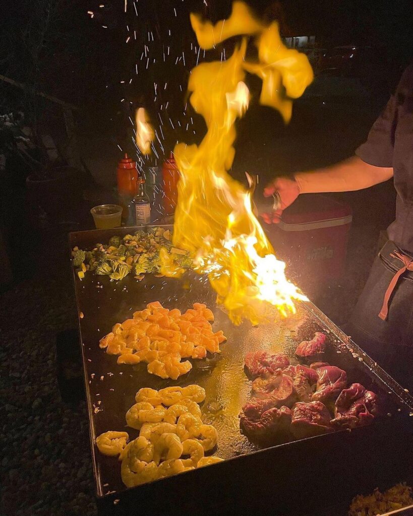 Hibachi chef night fire show with shrimp and steak